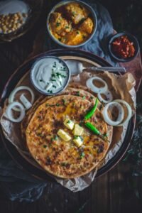 Aalu parota with sabgi, salad, yogurt 