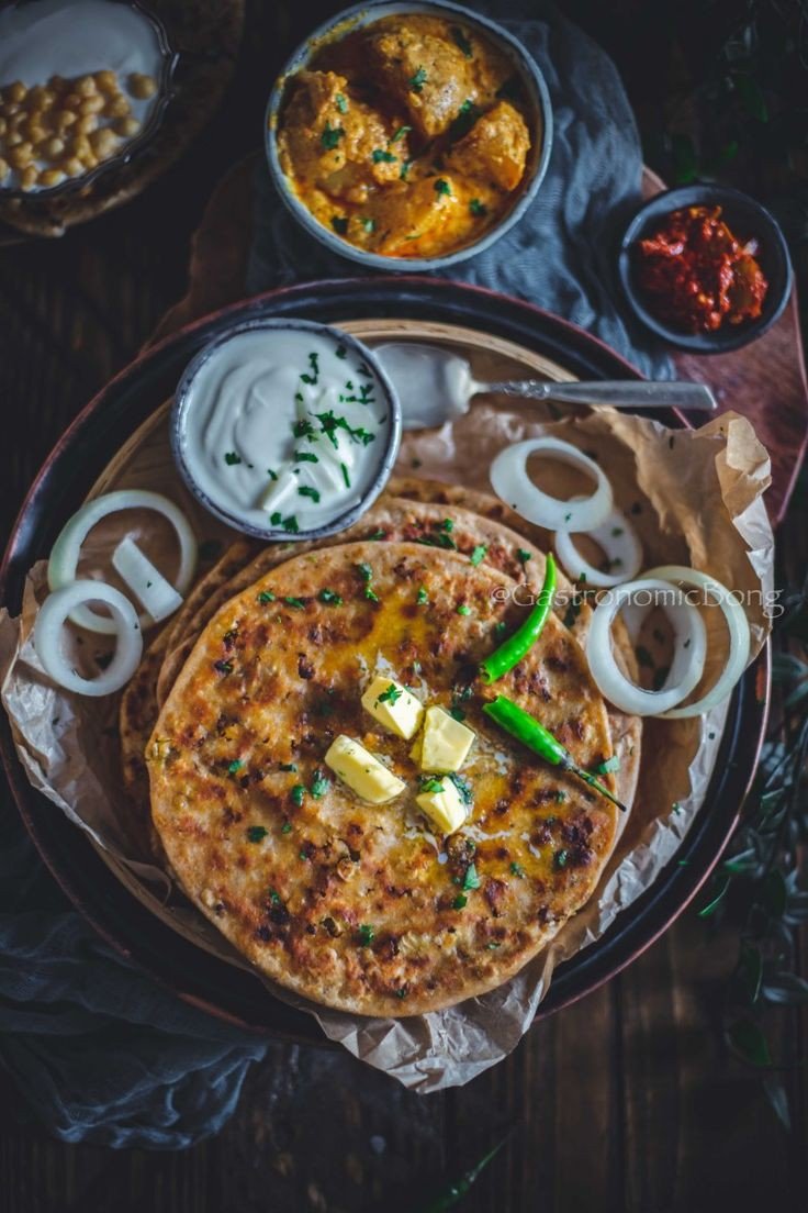 Aalu parota with sabgi, salad, yogurt