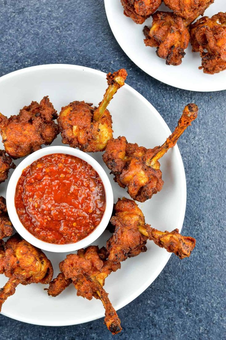 Crispy fried chicken lolipop with extra chilly sauce